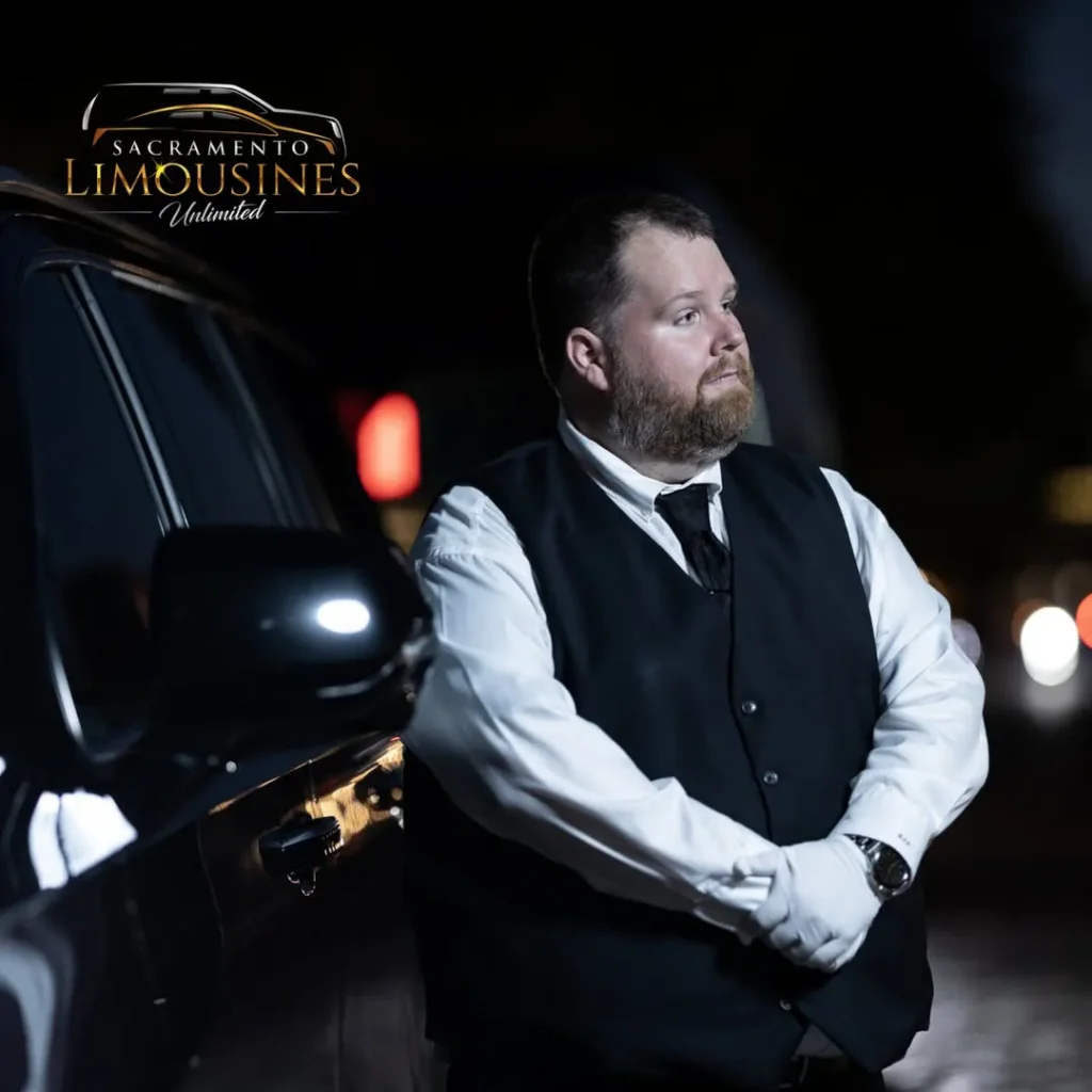 Sacramento Limousine Unlimited chauffeur beside a black luxury vehicle for El Dorado and Placerville wine tours